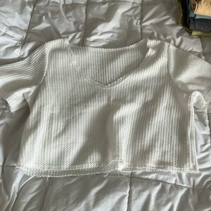 white cropped size small knitted v neck shirt